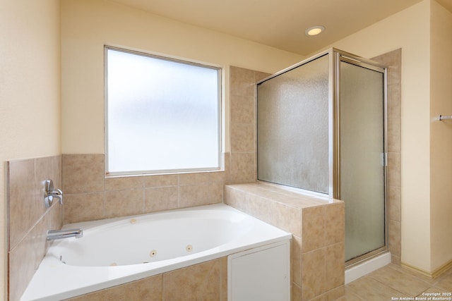 bathroom with tile patterned floors and separate shower and tub