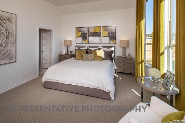 bedroom with lofted ceiling and carpet