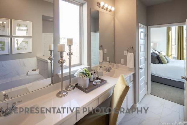 bathroom featuring vanity and a bath