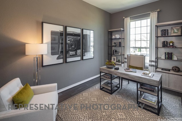 home office with dark hardwood / wood-style flooring