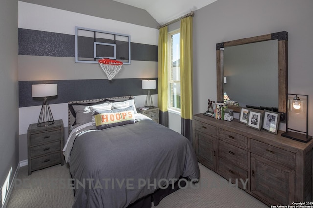 carpeted bedroom with vaulted ceiling