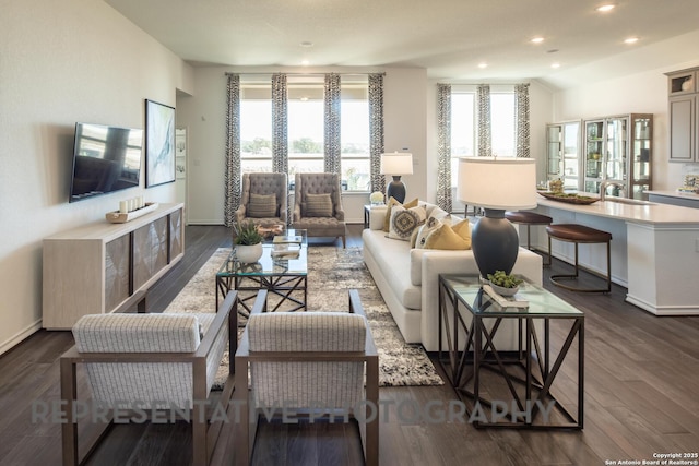 living room with dark wood-type flooring and vaulted ceiling