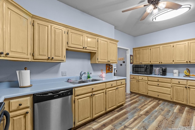 kitchen with sink, light brown cabinets, stainless steel dishwasher, hardwood / wood-style flooring, and ceiling fan