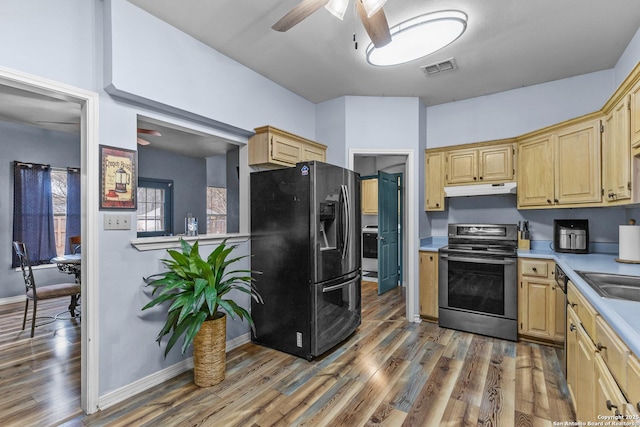 kitchen with ceiling fan, appliances with stainless steel finishes, light brown cabinets, and dark hardwood / wood-style flooring