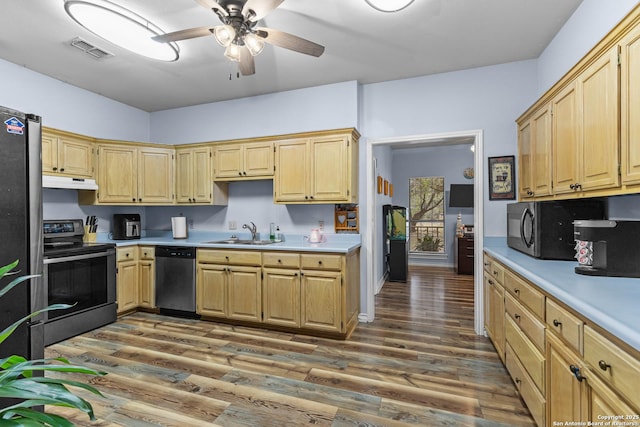 kitchen with light brown cabinetry, sink, dark hardwood / wood-style floors, ceiling fan, and stainless steel appliances