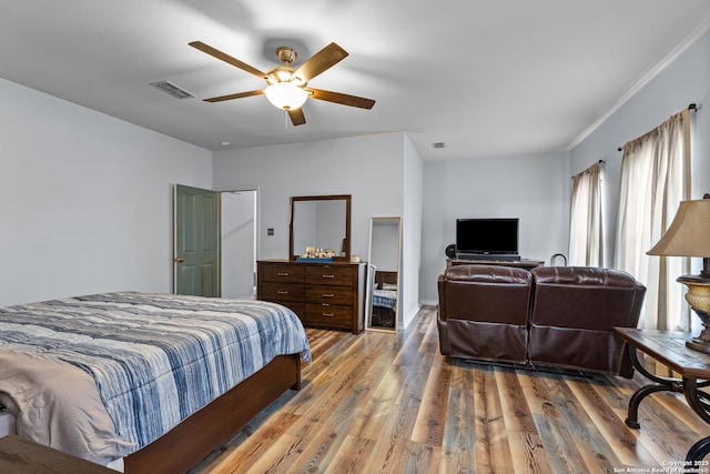 bedroom featuring hardwood / wood-style flooring and ceiling fan