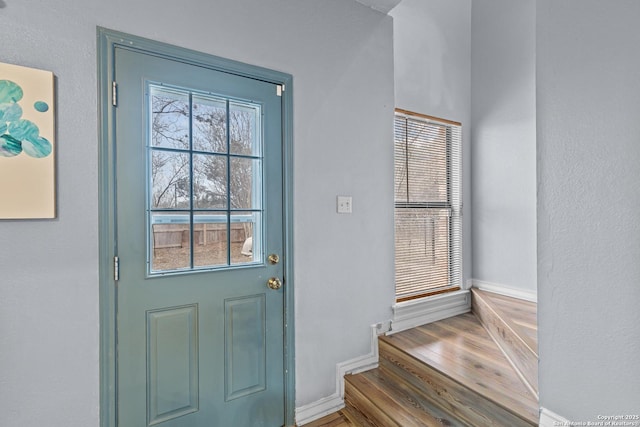 doorway with hardwood / wood-style floors