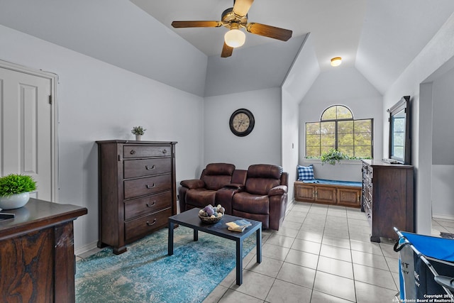 tiled living room with ceiling fan and lofted ceiling