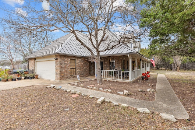 view of front of property featuring a garage and a porch