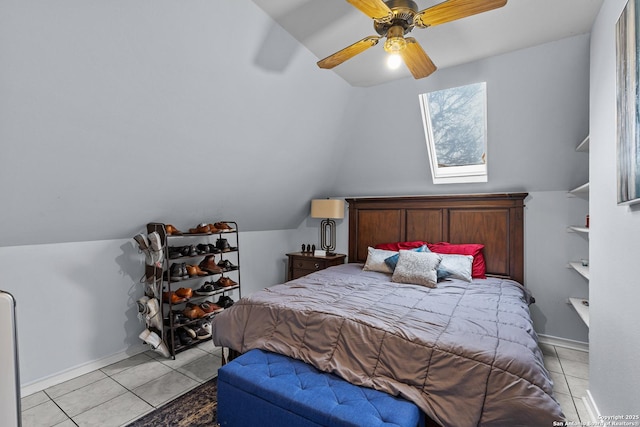 tiled bedroom featuring vaulted ceiling and ceiling fan