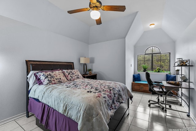 bedroom with vaulted ceiling, light tile patterned floors, and ceiling fan