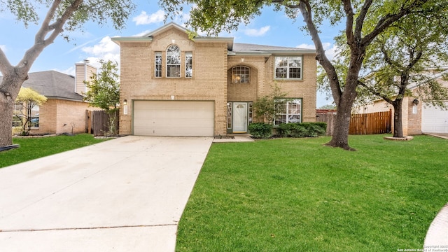 view of front of house with a garage and a front lawn