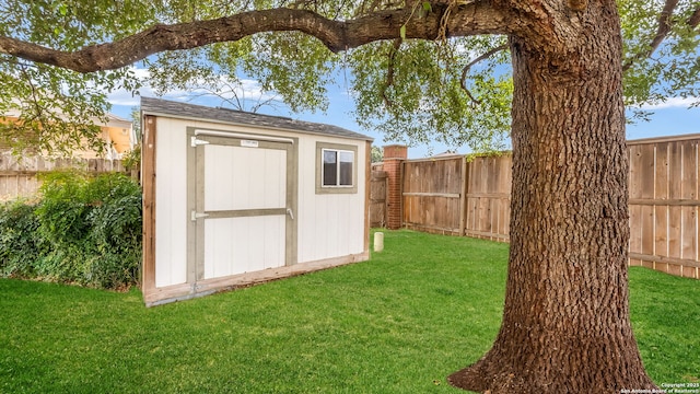 view of outbuilding featuring a lawn