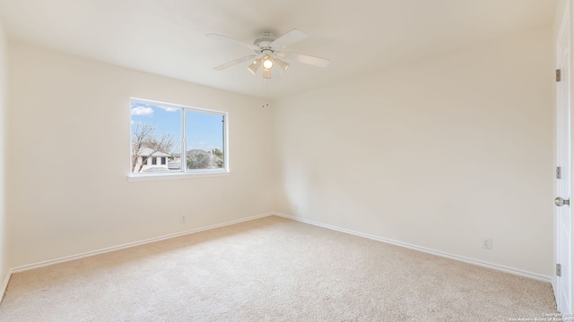 unfurnished room with light carpet and ceiling fan