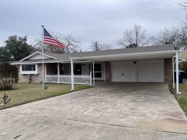 single story home with a garage and a front lawn