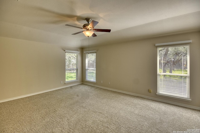 unfurnished room with ceiling fan and carpet floors