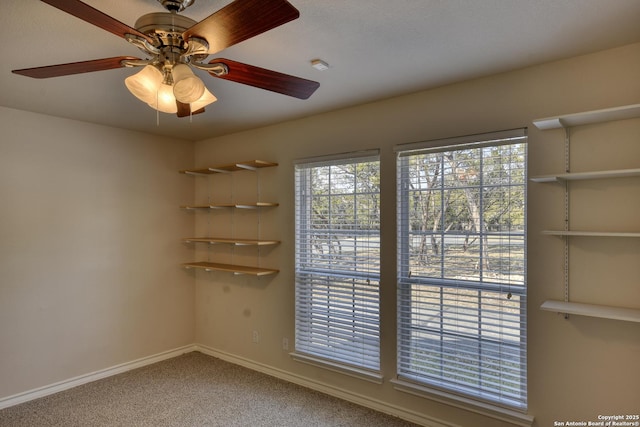 carpeted empty room with ceiling fan