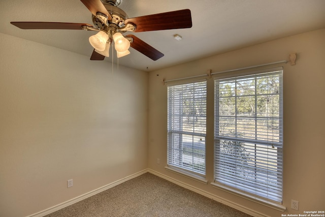 empty room with plenty of natural light and carpet