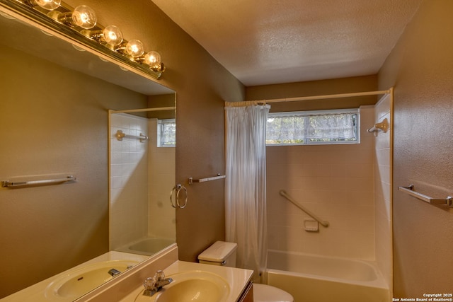 full bathroom with vanity, shower / tub combo, a textured ceiling, and toilet