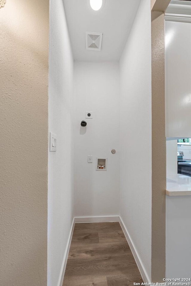 laundry room with hardwood / wood-style floors, hookup for a washing machine, and hookup for an electric dryer