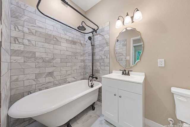 full bathroom with vanity, tiled shower / bath, and toilet