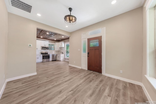 foyer with light wood-type flooring