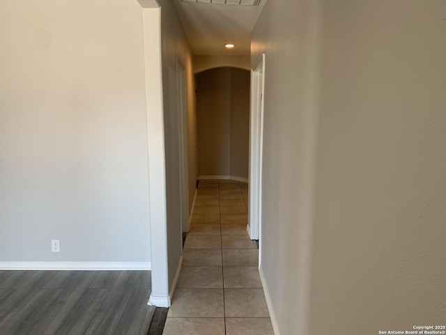 corridor with light tile patterned floors