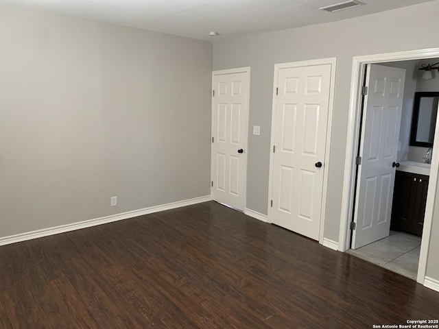 empty room with hardwood / wood-style flooring