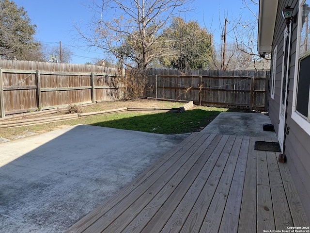 wooden terrace with a patio area and a lawn