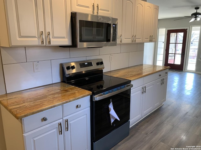 kitchen with white cabinetry, appliances with stainless steel finishes, and decorative backsplash