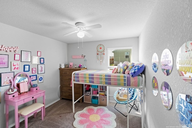 bedroom featuring ceiling fan, carpet floors, and a textured ceiling