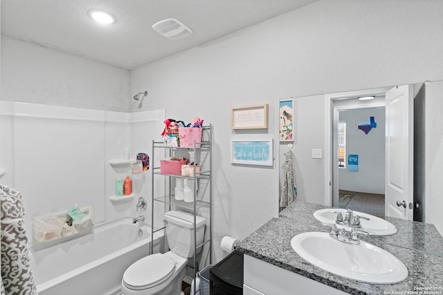 full bathroom featuring shower / tub combination, vanity, and toilet