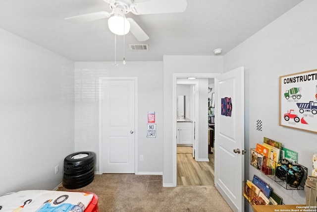 carpeted bedroom featuring ceiling fan