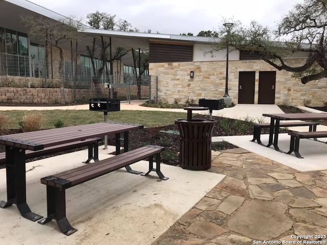 surrounding community with a patio area