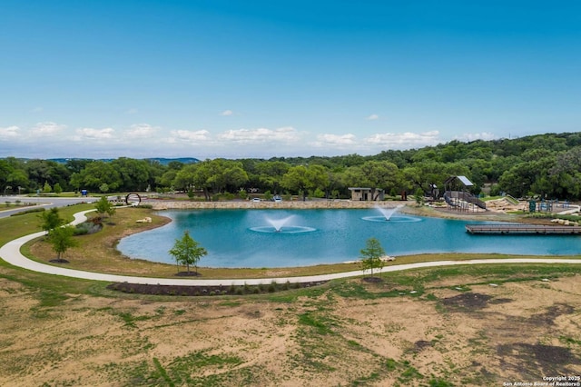 view of pool with a water view