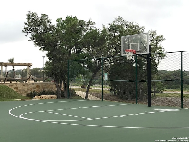 view of basketball court featuring a pergola