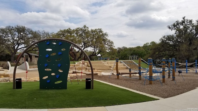 view of playground with a yard