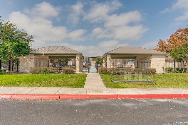 view of home's community with a yard