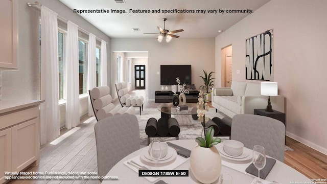 living room with ceiling fan and light hardwood / wood-style floors