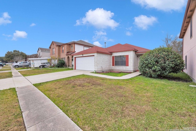 view of front of house featuring a garage and a front lawn