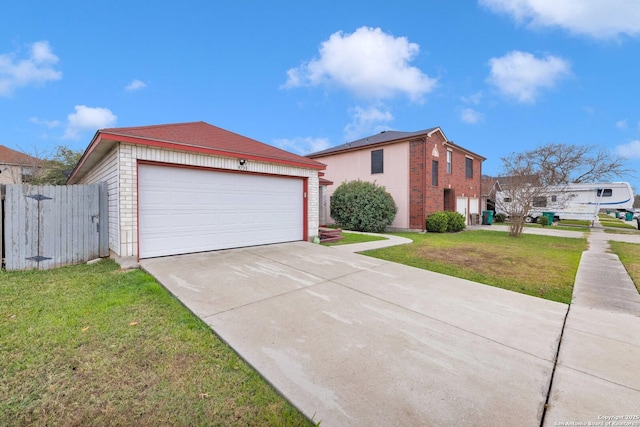 view of front facade with a garage and a front lawn