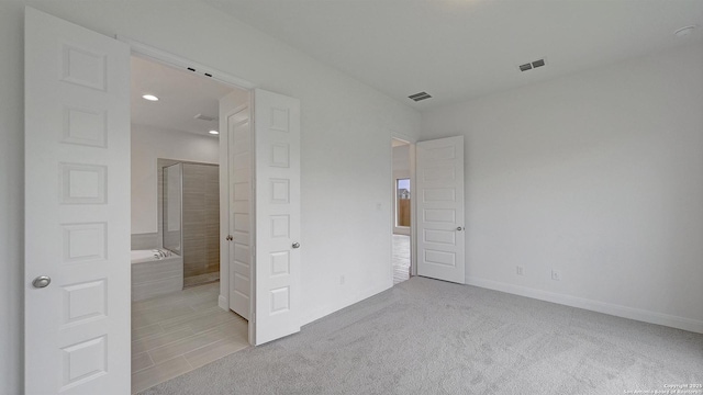2623 Vistablue Ln, San Antonio, TX 78245 - unfurnished bedroom with baseboards, light colored carpet, and recessed lighting