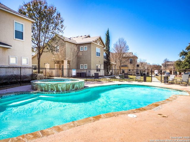 view of pool featuring a patio area and a community hot tub