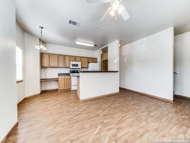 kitchen with ceiling fan, light wood-type flooring, white appliances, and decorative light fixtures