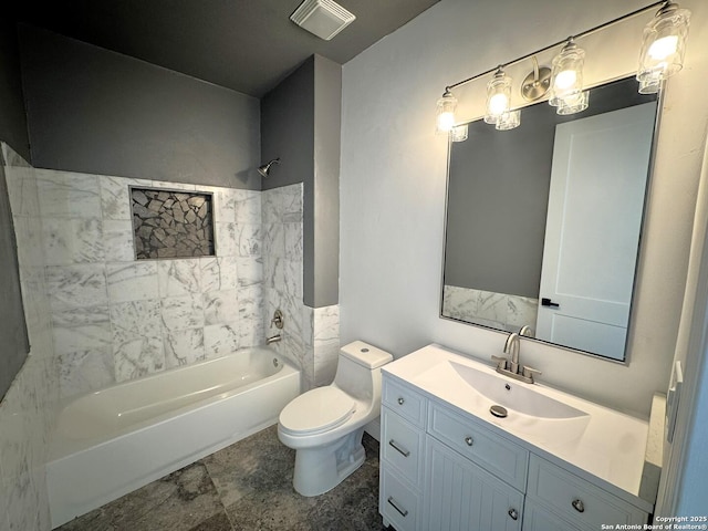 full bathroom with tiled shower / bath, vanity, and toilet