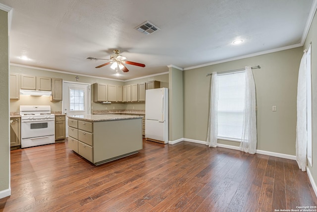 kitchen featuring white appliances, crown molding, ceiling fan, a kitchen island, and dark hardwood / wood-style flooring