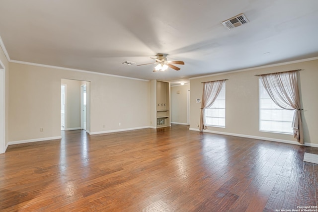 spare room featuring crown molding, ceiling fan, and hardwood / wood-style floors