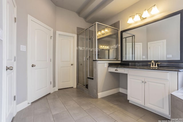 bathroom featuring vanity and a shower with shower door