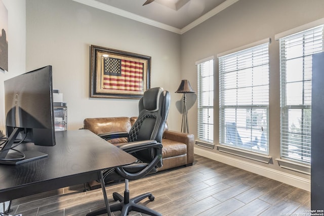 home office featuring crown molding, ceiling fan, and a healthy amount of sunlight