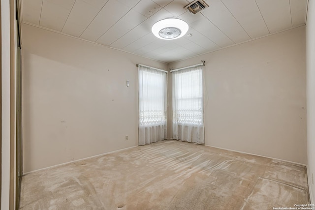 empty room featuring light carpet